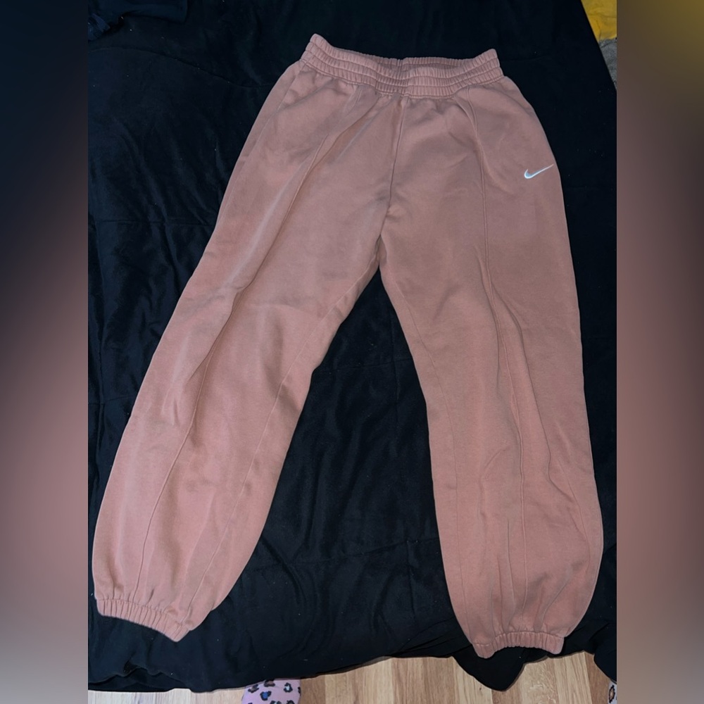 Orange ish Nike sweatpants. Size large